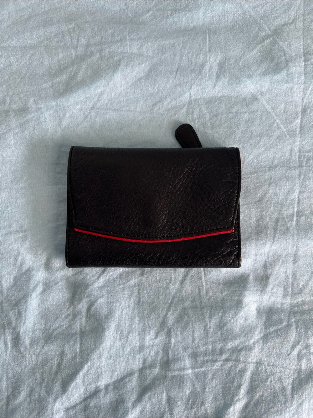 Osgoode Marley Black Leather Trifold Wallet with Red Accent